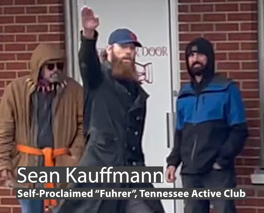 Sean Kauffmann throws up a Nazi salute before greeting Proud Boys and others